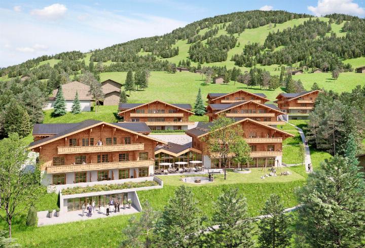 Auf einem Areal von etwa 10’000m2 soll eine Bildungs- und Ferienoase entstehen mit einem Restaurant in der Mitte (im Vordergrund) sowie bezahlbarer Wohnraum für Einheimische in den vier Gebäuden dahinter. VISUALISIERUNG: ZVG